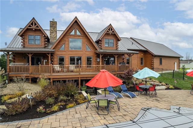 rear view of property featuring a patio