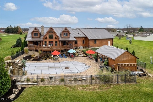 exterior space featuring a patio area, a yard, and a deck