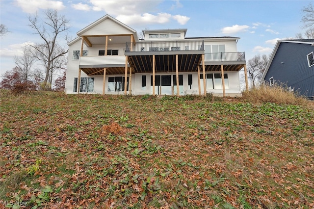 back of property featuring a wooden deck