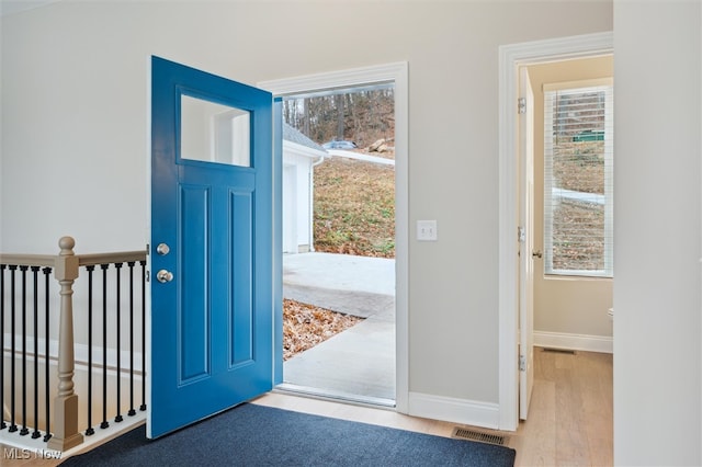 entryway with light hardwood / wood-style flooring