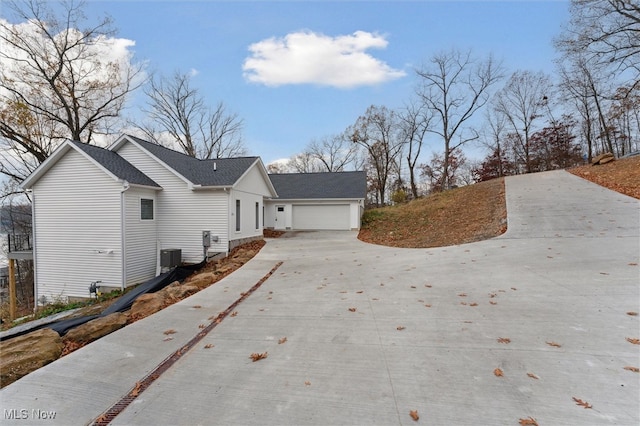 view of side of property with a garage