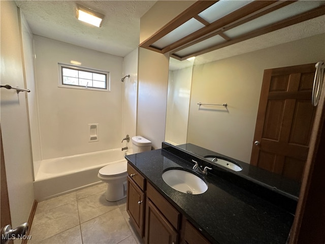 full bathroom with tub / shower combination, vanity, a textured ceiling, tile patterned flooring, and toilet