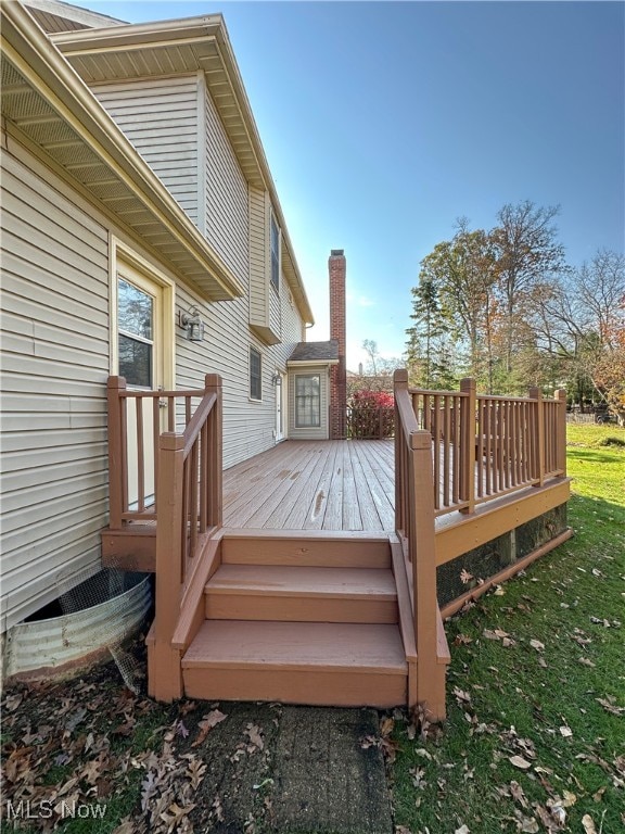 deck featuring a lawn