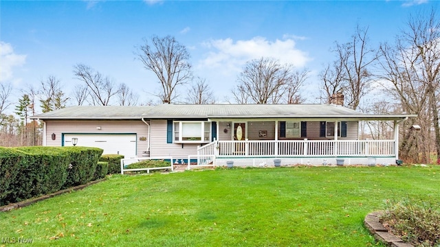 single story home with covered porch, a garage, and a front yard