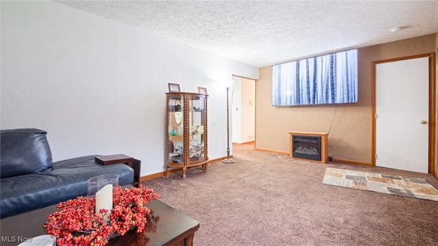 carpeted living room featuring a textured ceiling