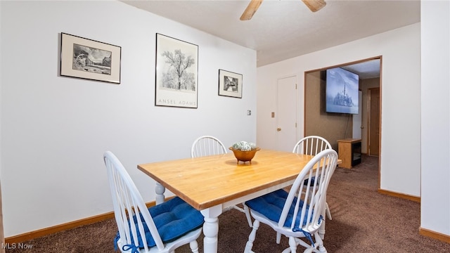 carpeted dining room featuring ceiling fan