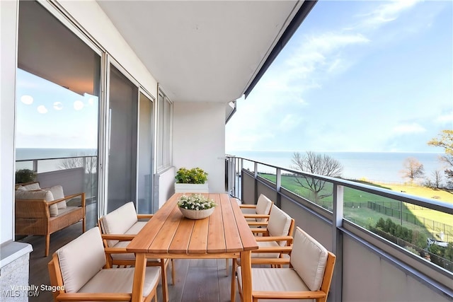 balcony featuring a water view