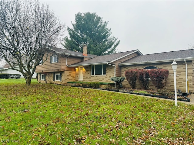 split level home with a front yard