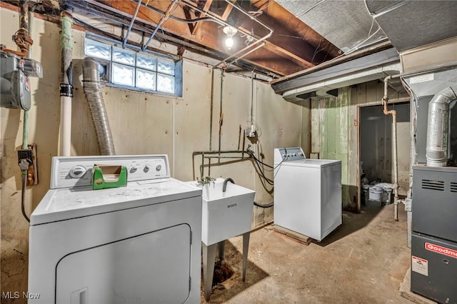 washroom featuring separate washer and dryer and sink