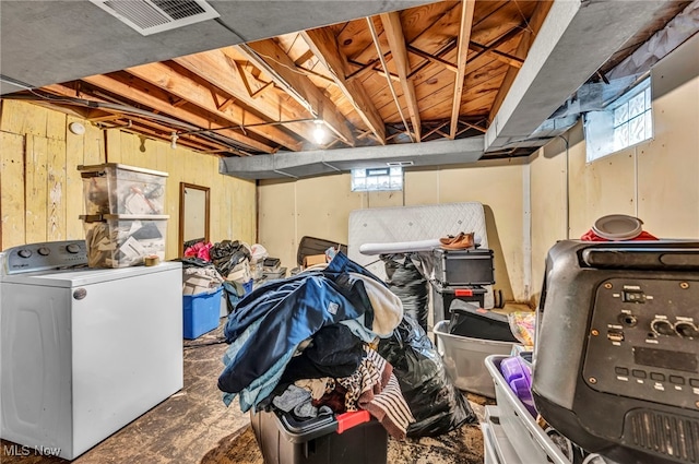 basement featuring washer / clothes dryer and a healthy amount of sunlight