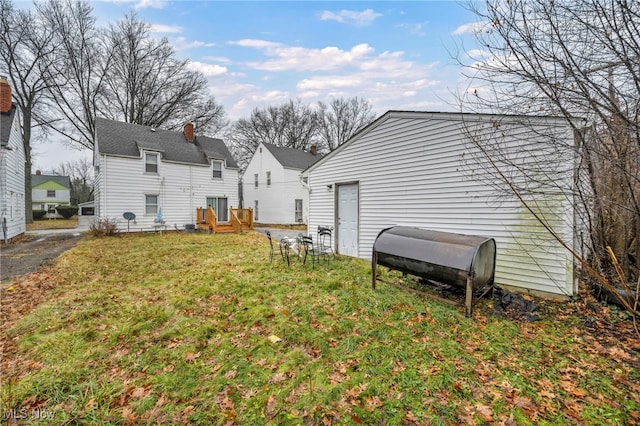 rear view of house with a yard