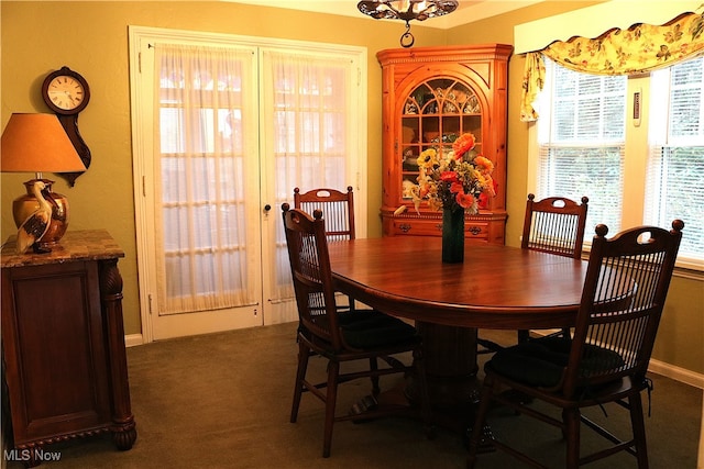 view of carpeted dining area