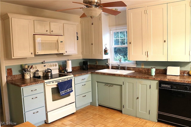 kitchen featuring white appliances, light parquet floors, ceiling fan, sink, and white cabinets