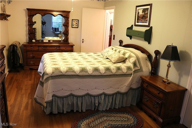 bedroom featuring dark hardwood / wood-style floors