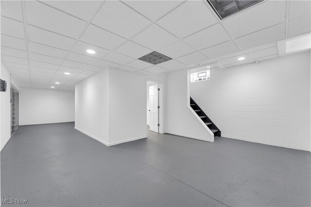 basement featuring a drop ceiling