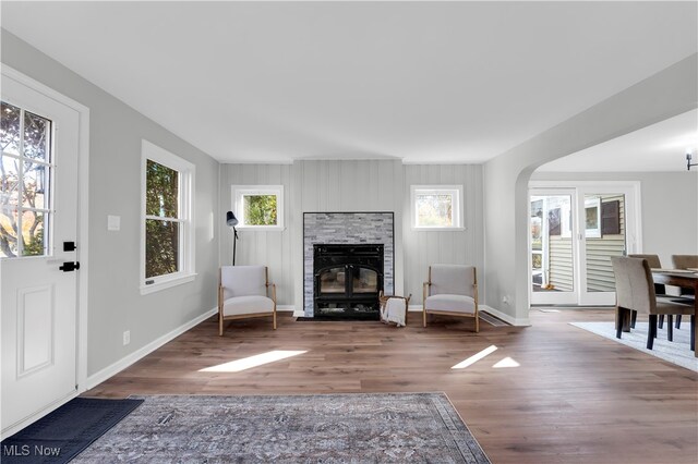 living area with a fireplace and hardwood / wood-style floors