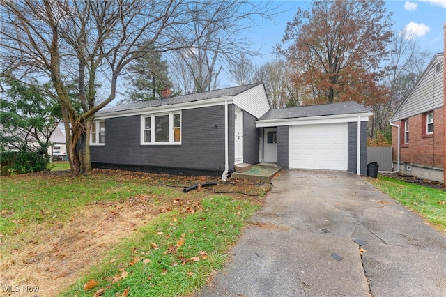 single story home featuring a front yard and a garage