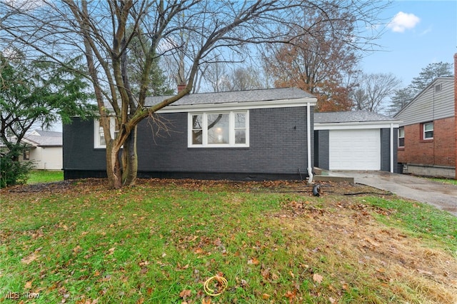 view of front of home with a garage and a front yard