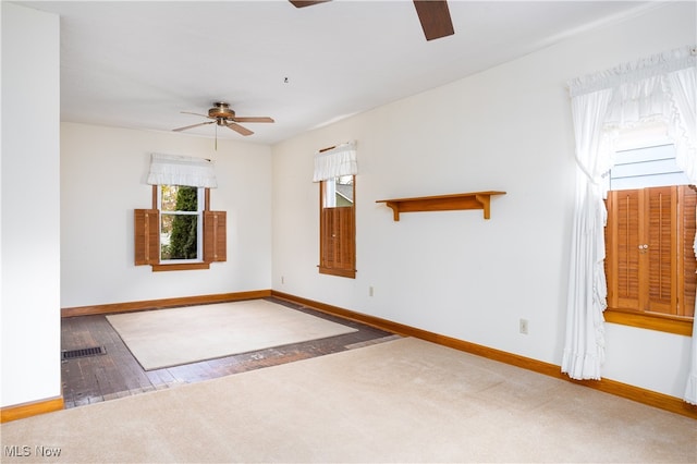 empty room featuring wood-type flooring and ceiling fan