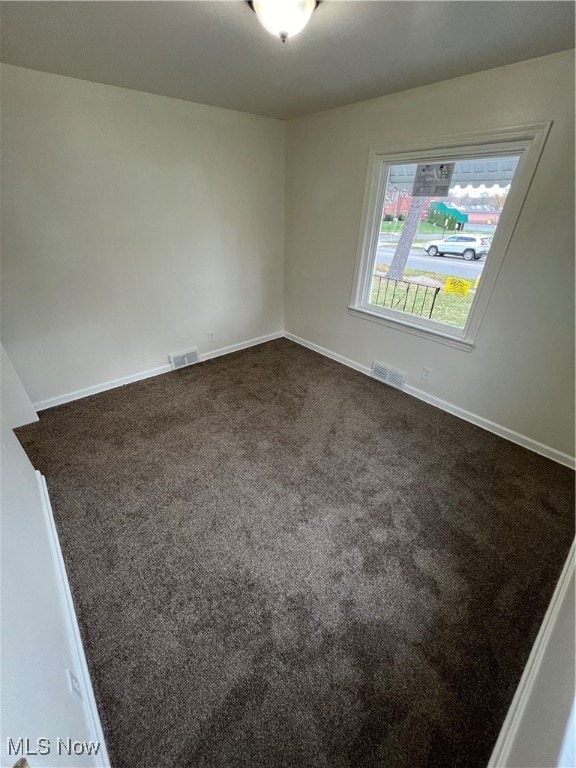 empty room with carpet flooring