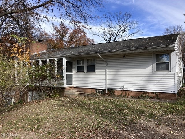 rear view of house with a sunroom