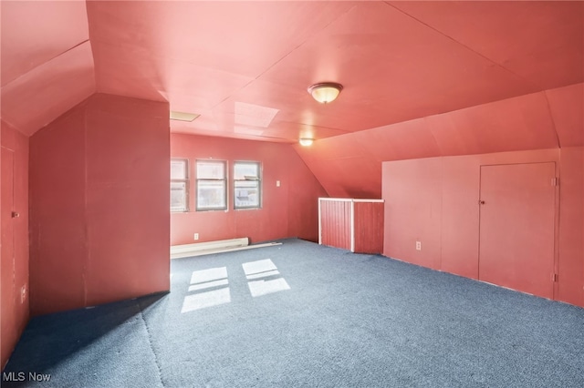 bonus room featuring carpet flooring, lofted ceiling, and a baseboard heating unit