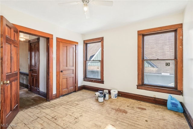 unfurnished room with ceiling fan