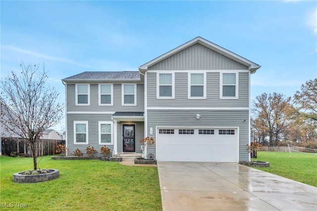 view of front of house with a garage and a front lawn