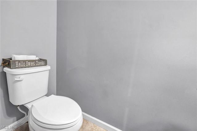 bathroom featuring tile patterned flooring and toilet