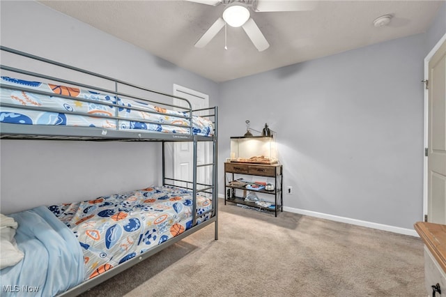 bedroom featuring ceiling fan and carpet floors