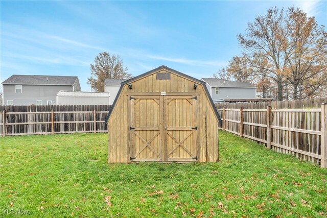 view of outdoor structure with a lawn