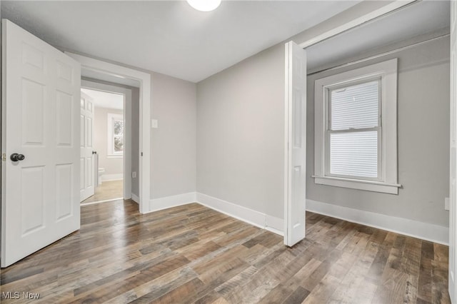 spare room featuring hardwood / wood-style flooring