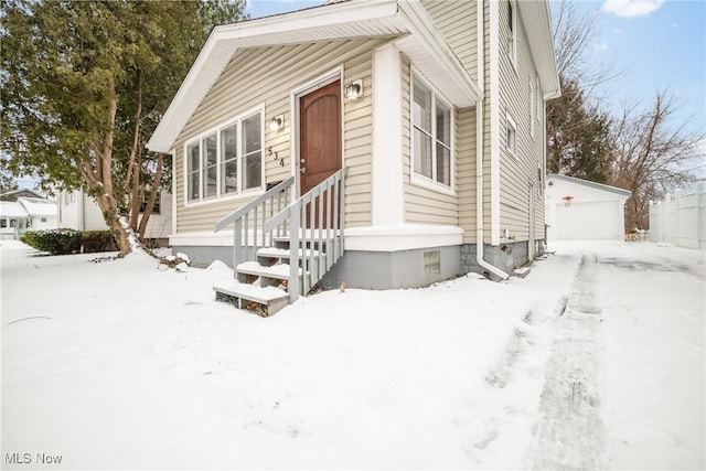 view of front of house with an outbuilding and a garage