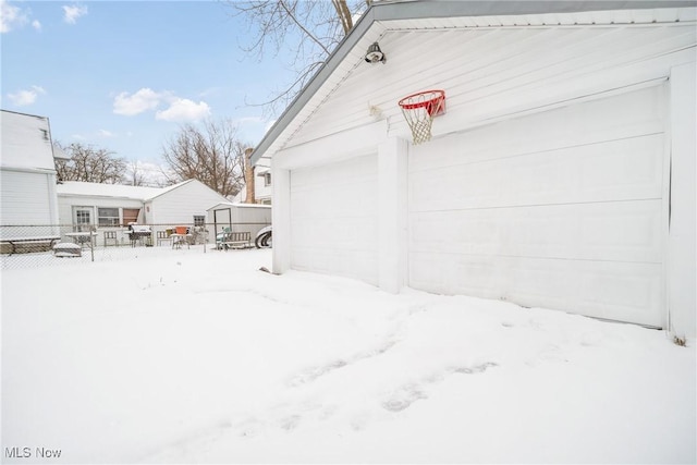 snowy yard with an outdoor structure