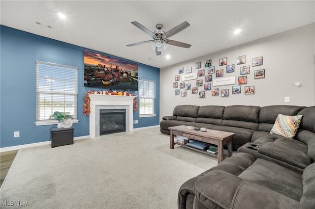 living room with carpet floors and ceiling fan