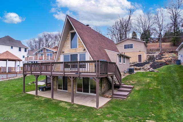 back of house with a patio, a deck, cooling unit, and a lawn