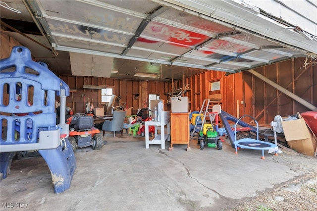 garage with wood walls