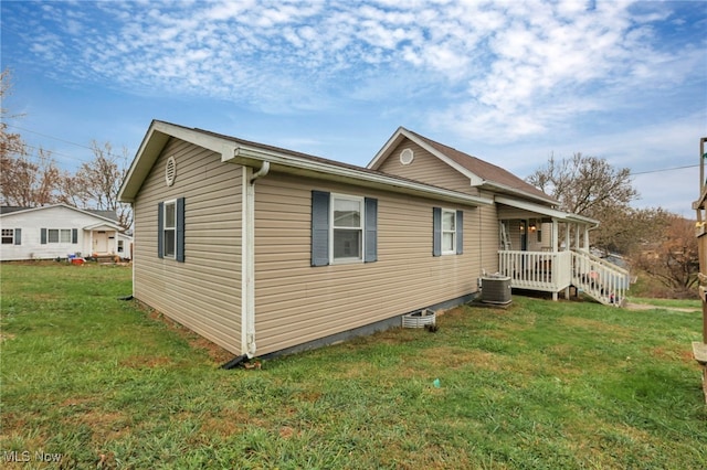 view of property exterior featuring a yard and central AC