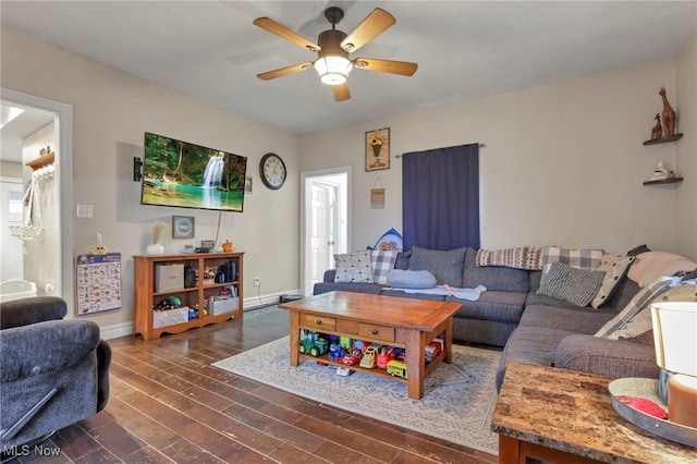 living room featuring dark hardwood / wood-style floors and ceiling fan