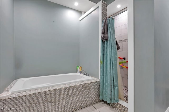 bathroom with tile patterned flooring and a shower with shower curtain