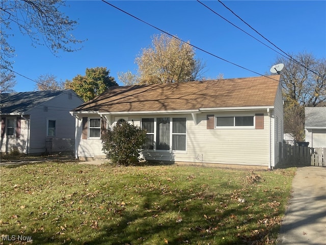 rear view of property with a yard