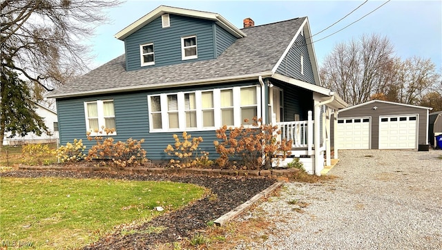 view of front facade with an outbuilding and a garage