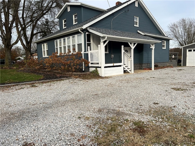 view of front of house with an outdoor structure and a garage