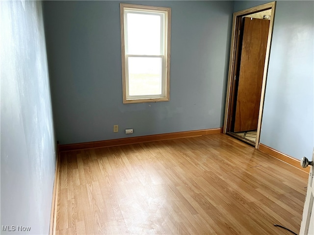 spare room featuring light hardwood / wood-style flooring