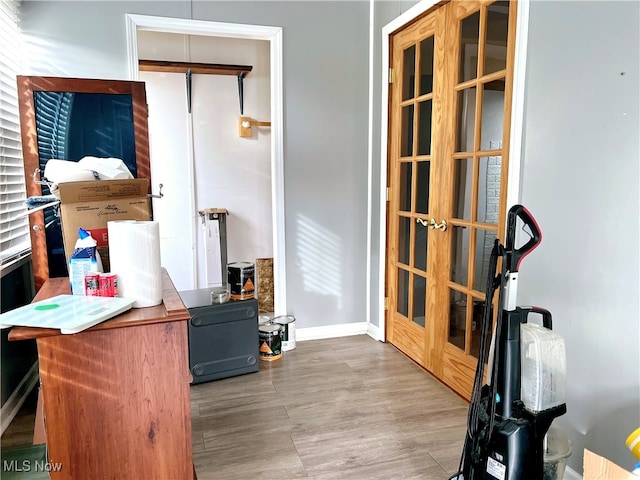 interior space with hardwood / wood-style floors and french doors