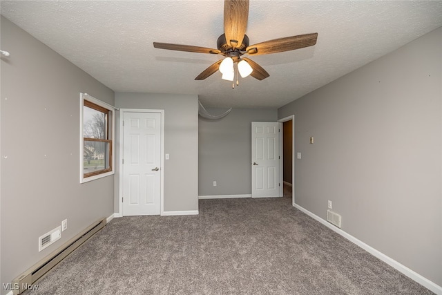 unfurnished bedroom featuring a textured ceiling, a baseboard radiator, ceiling fan, and carpet floors