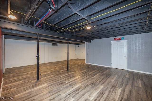 basement with wood-type flooring