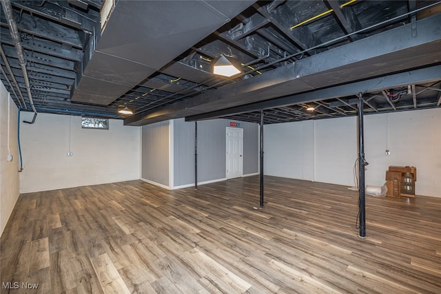 basement featuring wood-type flooring