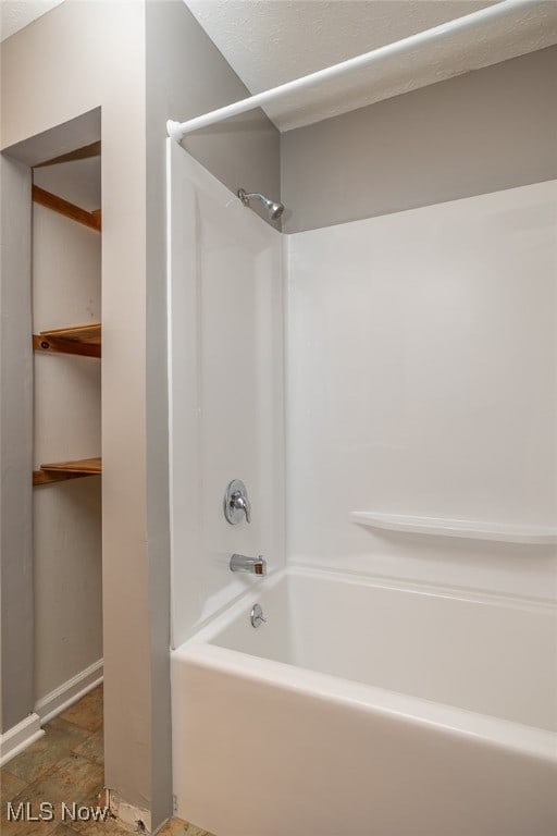 bathroom with shower / washtub combination