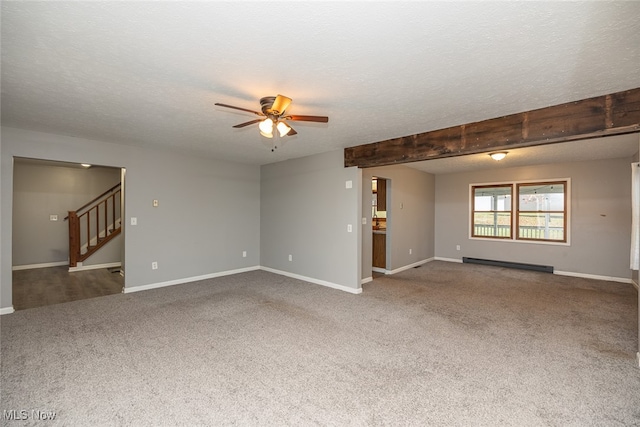 unfurnished living room featuring carpet, ceiling fan, baseboard heating, and a textured ceiling